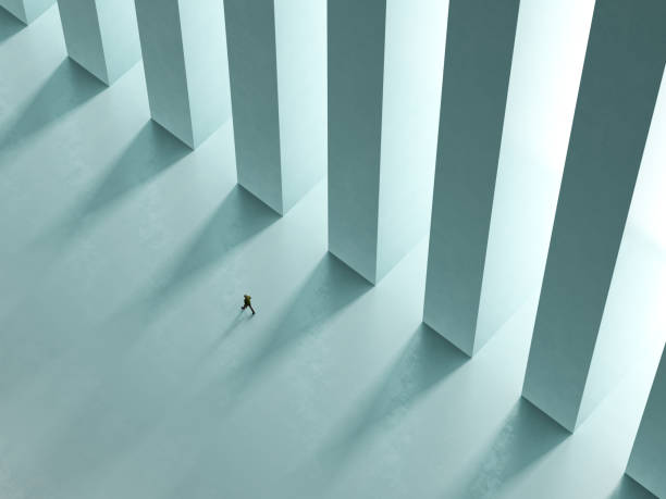 istock a lonely man walk the corridor with columns to the light 3D rendering 917862208