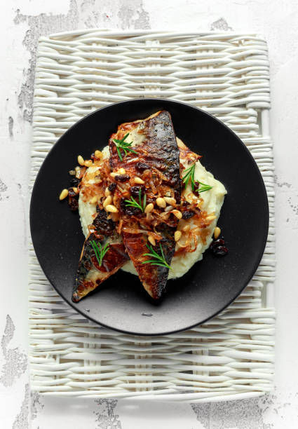 istock Sicilian style mackerel on cauliflower puree with caramelized onions, pine nuts 917865762