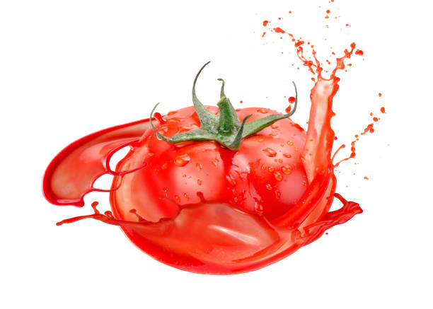 istock tomato in juice splash isolated on a white background 917873154