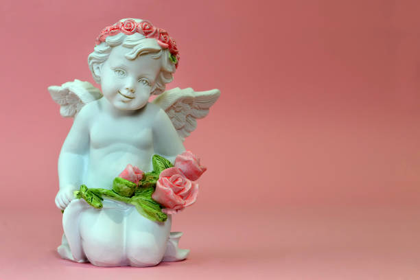 istock Guardian angel holding flowers 917874698