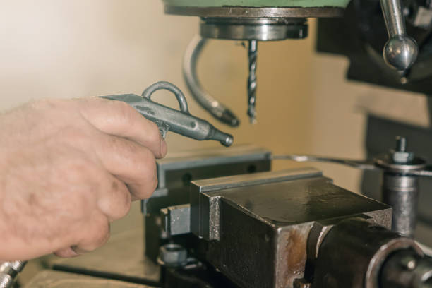 istock Employee drilling. Metal drilling. Metal workshop. 917878548