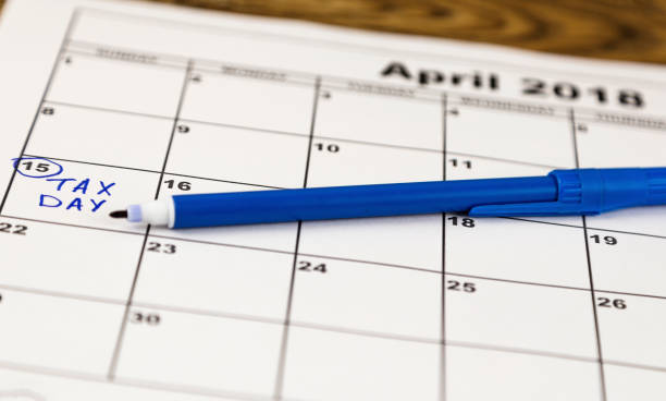 istock Calendar with a red box around Tax Day, April 15th 917878576