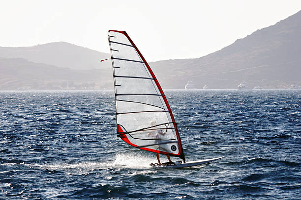 speeding windsurfer stock photo