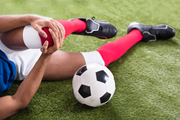istock Injured Soccer Player On Field 917885578