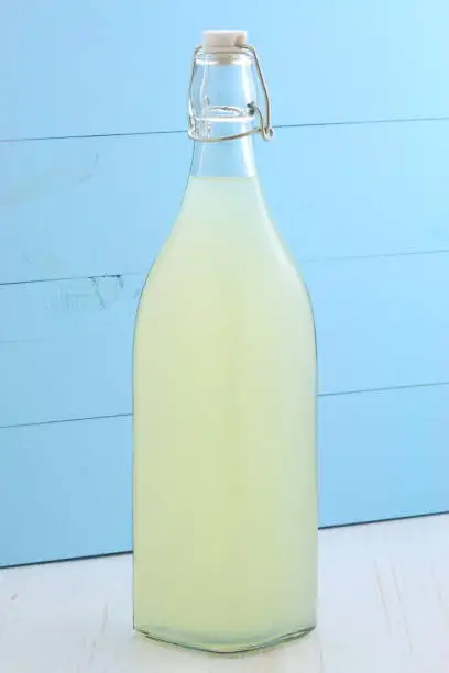 delicious and nutritious, organic lemonade on vintage bottle and glass