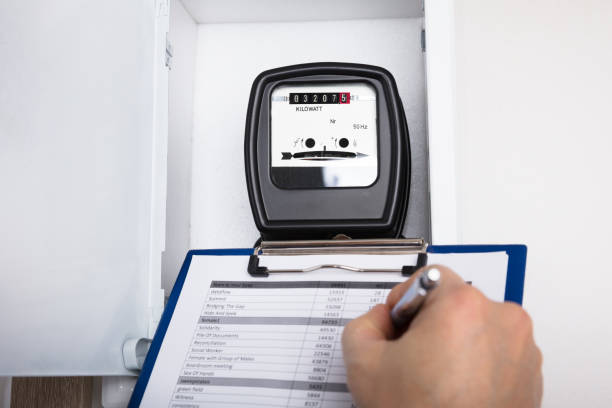 istock Technician Writing Reading Of Meter On Clipboard 917888972