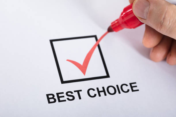 Person Ticking Best Choice In Check Box Option Close-up Of A Person Hand Ticking Best Choice In Check Box Option Using Red Marker chief leader photos stock pictures, royalty-free photos & images