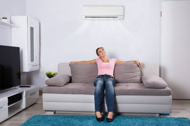 istock Woman Relaxing Under The Air Conditioner 917892738