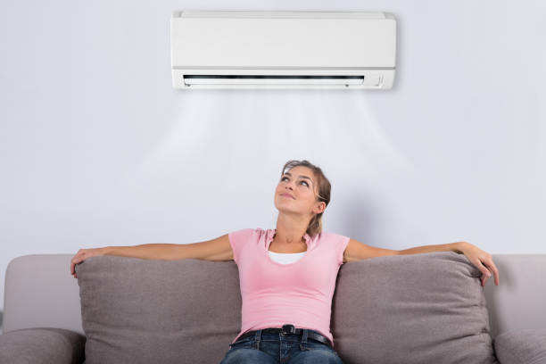 istock Woman Relaxing Under The Air Conditioner 917892764