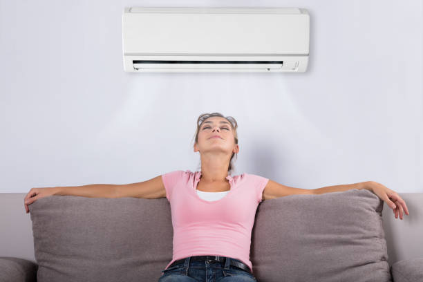 istock Woman Relaxing Under The Air Conditioner 917892766