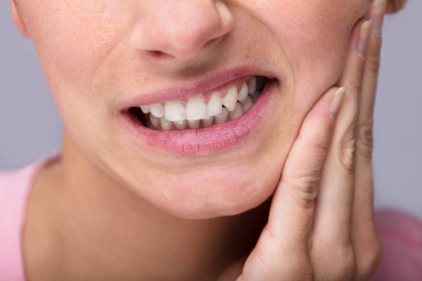 Young Woman Suffering From Toothache Close-up Of Young Woman Suffering From Toothache At Home toothache stock pictures, royalty-free photos & images