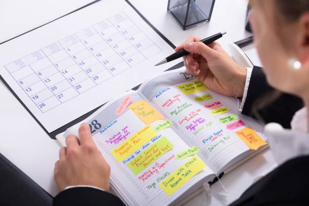 istock Businesswoman Marking Schedule 917893156