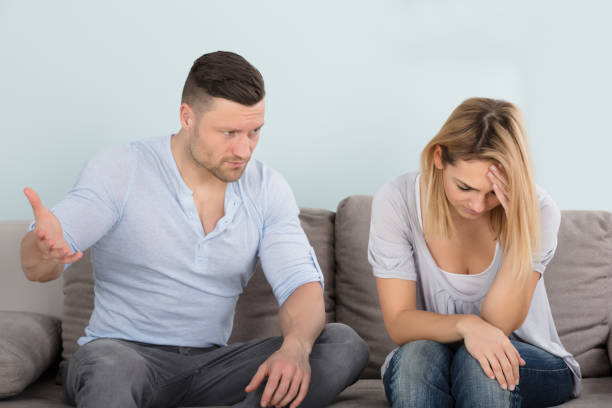 istock Man Looking At His Depressed Wife 917895782