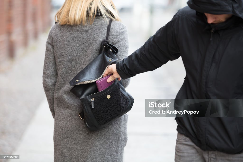 Person Stealing Purse From Handbag Close-up Of A Person Stealing Purse From Handbag Thief Stock Photo