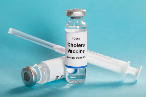 Cholera Vaccine In Vial With Syringe One Dose Cholera Vaccine In Vial With Syringe Over Turquoise Background vibrio stock pictures, royalty-free photos & images