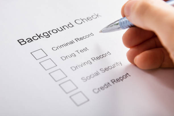 person hand filling background check form - to do list audio imagens e fotografias de stock