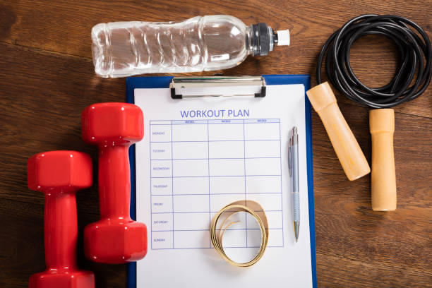 istock Workout Plan Form With Fitness Equipments 917896570