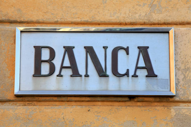 istock Bank sign on stone wall facade, Italy 917896798