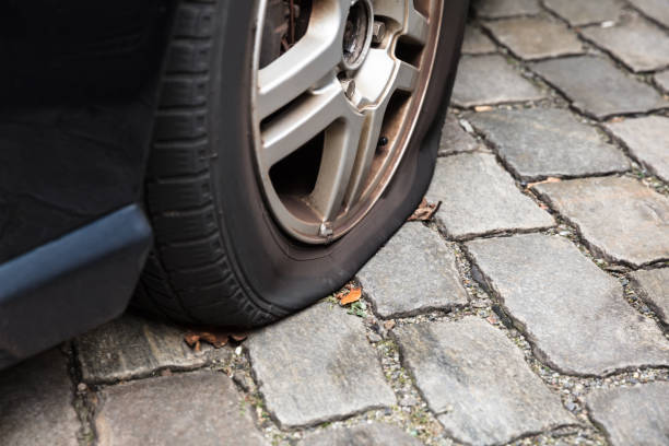 istock Damaged Flat Tire Of A Car 917897240