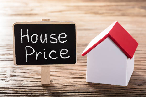 istock Text House Price Written On Blackboard With A House Model 917901030