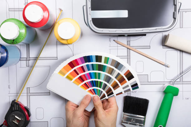 istock An Architect Choosing Color From Swatch On Blueprints 917901530