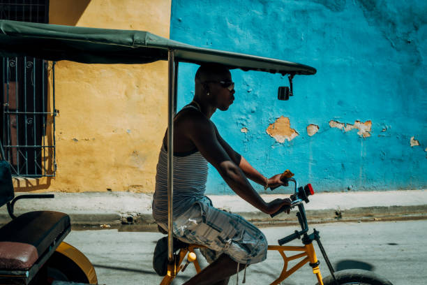 istock Bicycle taxi driver with his vehicle, Cuba 917901788