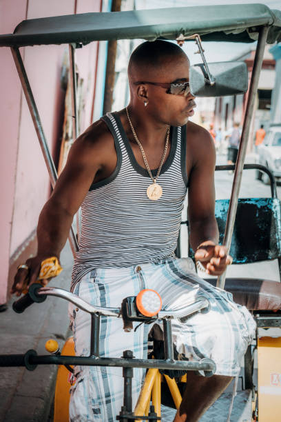 istock Bicycle taxi driver with his vehicle, Cuba 917901928