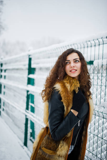 istock Elegance curly girl at winter day 917902062