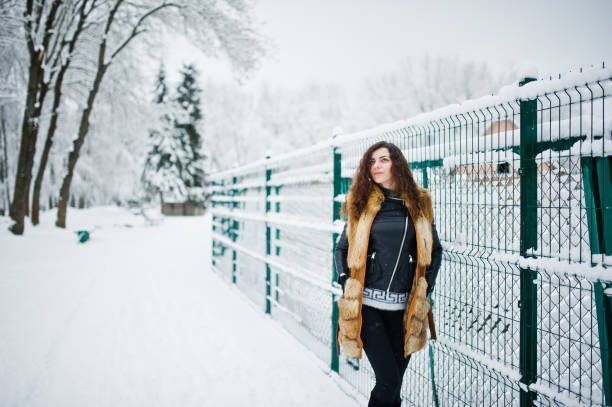istock Elegance curly girl at winter day 917902064