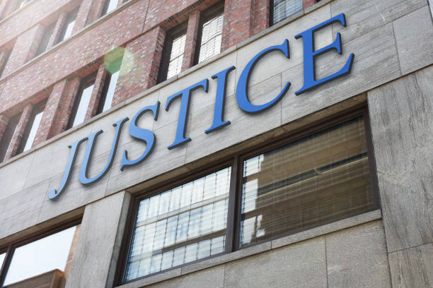 istock Justice sign on modern building in city 917906518