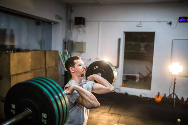 istock Male Body Builder Doing Weightlifting Exercises 917908036