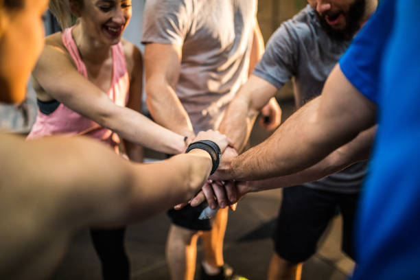 Gym Crew Group Of People Cheering Before Sports Training In Gym community health center stock pictures, royalty-free photos & images