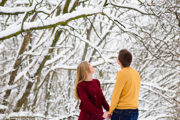 istock Romantic young couple holding hands outdoors 917914686