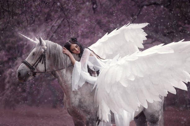 istock Beautiful, young elf, walking with a unicorn. 917914964