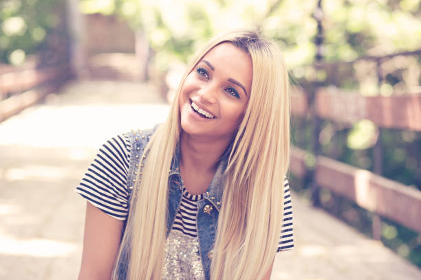 istock Laughing pretty blonde in nature 917918306
