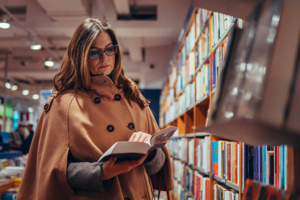 istock Woman searching for new book 917919006