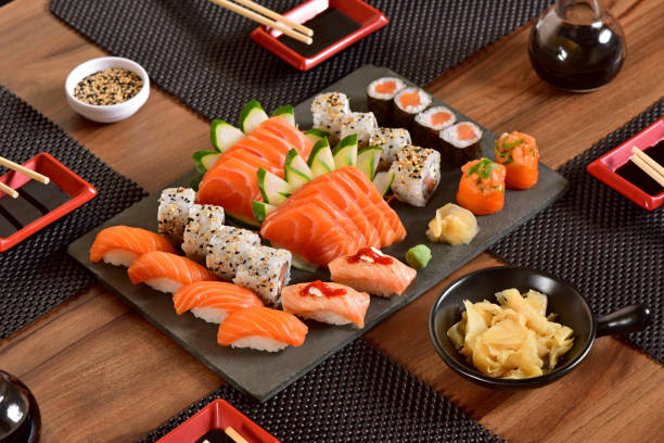 Japanese food Japanese food mix on rustic board in a restaurant table seafood photos stock pictures, royalty-free photos & images