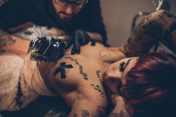 istock Modern girl with a new tattoo 917921862