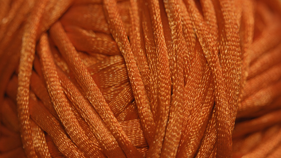 Hank of orange shiny lace
