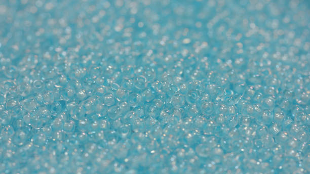 istock Pile of small blue beads 917921970