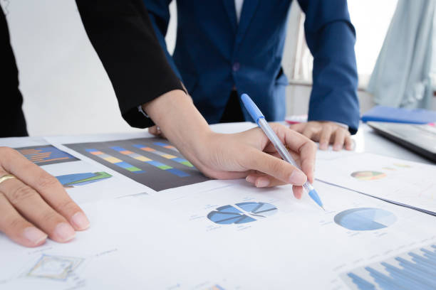 istock Business team meeting concept : Investor executive discussing plan financial graph data on office table with laptop and tablet, finance, accounting, investment, meeting. 917922808