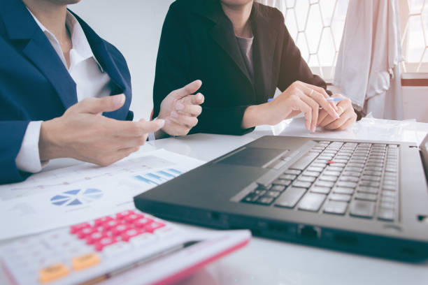 istock Business team meeting concept : Investor executive discussing plan financial graph data on office table with laptop and tablet, finance, accounting, investment, meeting. 917922976