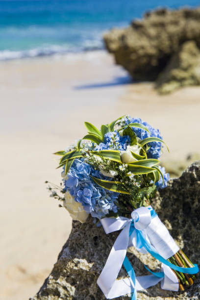 istock Bride wedding bouque is on the beach 917923164
