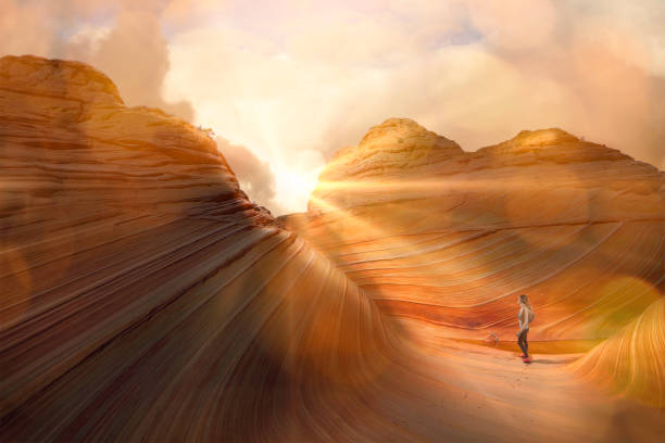 Woman hiking the Wave in Arizona permit access only The Wave in Arizona permit access only the wave arizona stock pictures, royalty-free photos & images
