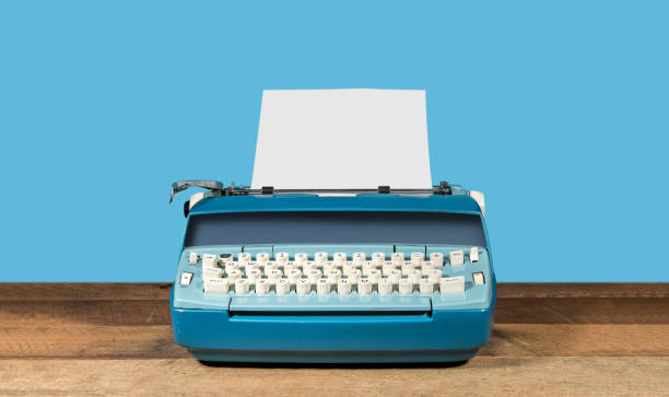istock Old electric typewriter on wood table background 917923848
