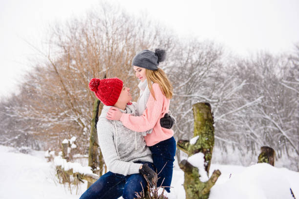 istock Happy young couple at winter background 917924058