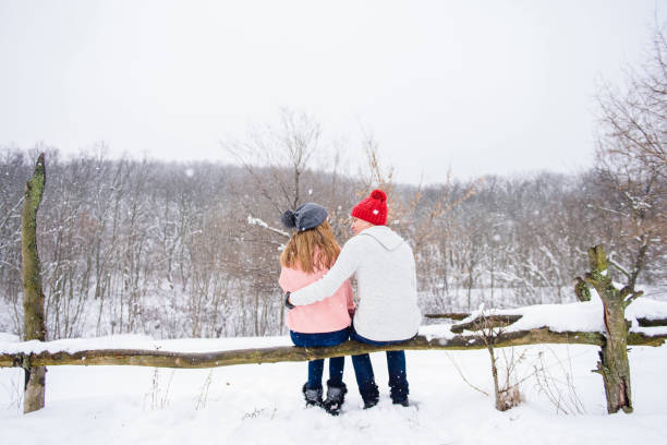 istock Happy couple at snow background from back 917926208