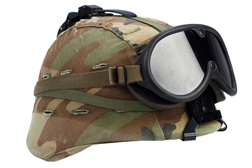us army kevlar helmet with goggles isolated on white