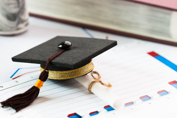 istock Graduate study international abroad concept, Graduation cap, scroll certificate near on documents report chart. Graduate study abroad program for students foreign county, Study abroad lead to success 917929176