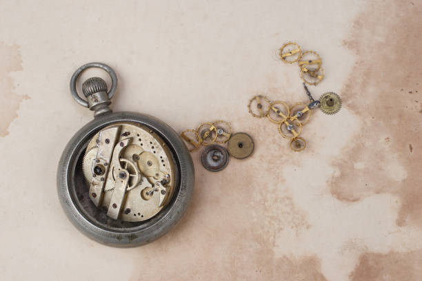 istock broken vintage pocket watch on dirty paper background 917929346